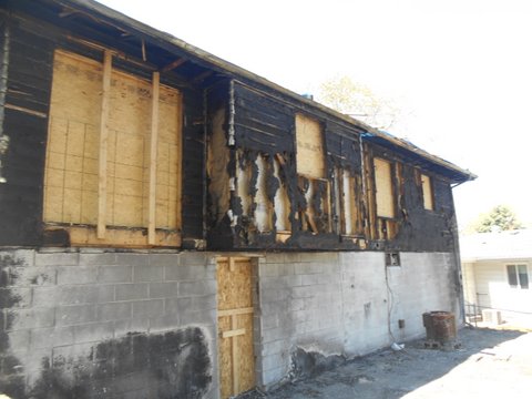 Damage after a home fire back of the house